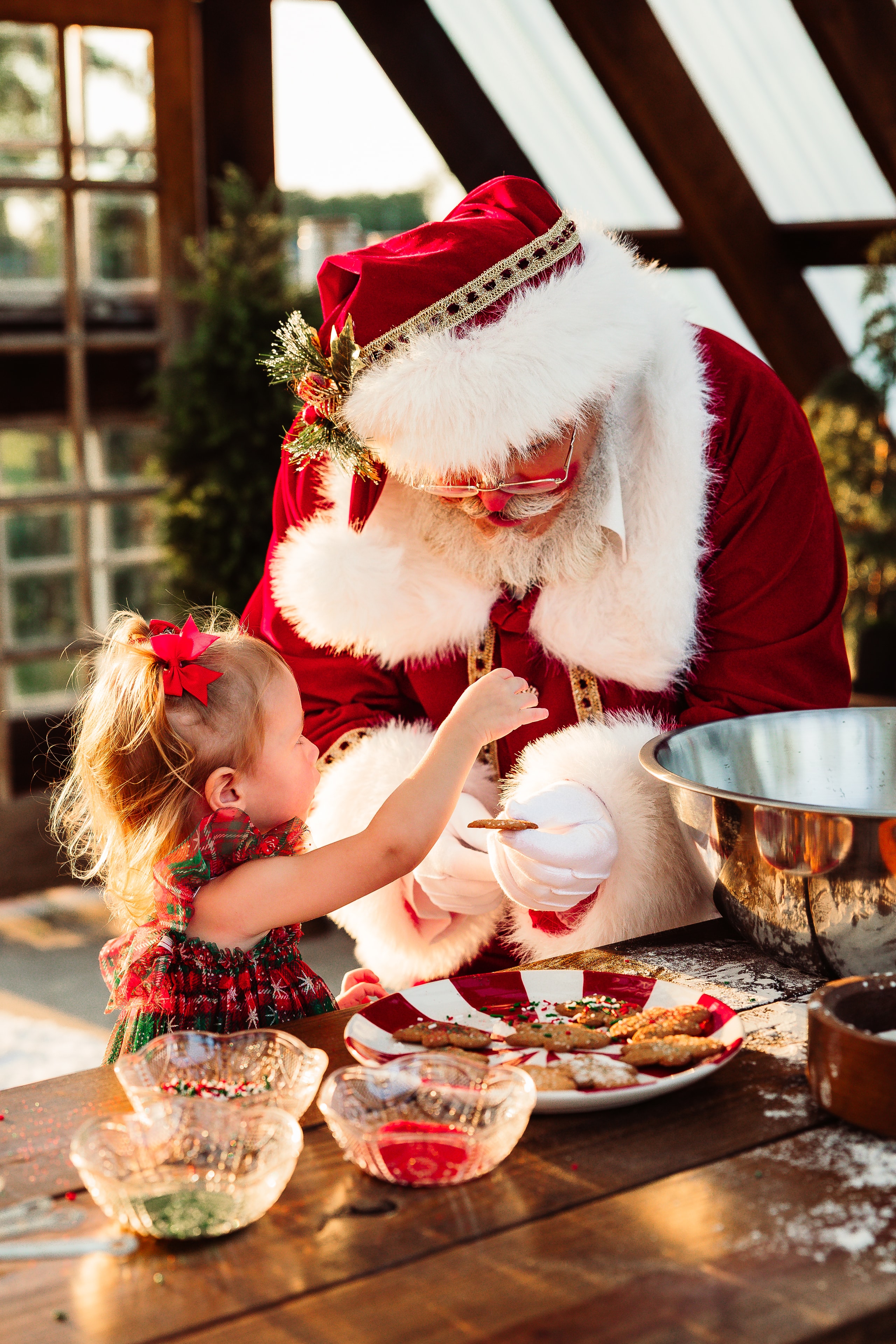 Santa baking cookies with a child